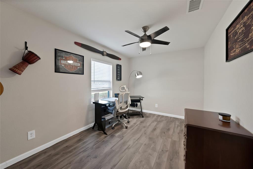 604 Moore Street Garland, TX 75040 - Photo 10 of 26 a view of a livingroom with workspace and a window