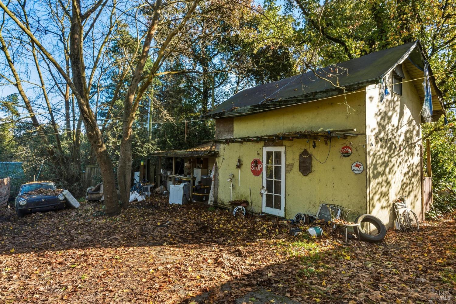 5070 Blank Road Sebastopol, CA 95472 - Photo 22 of 36 a view of a house with a yard and a tree