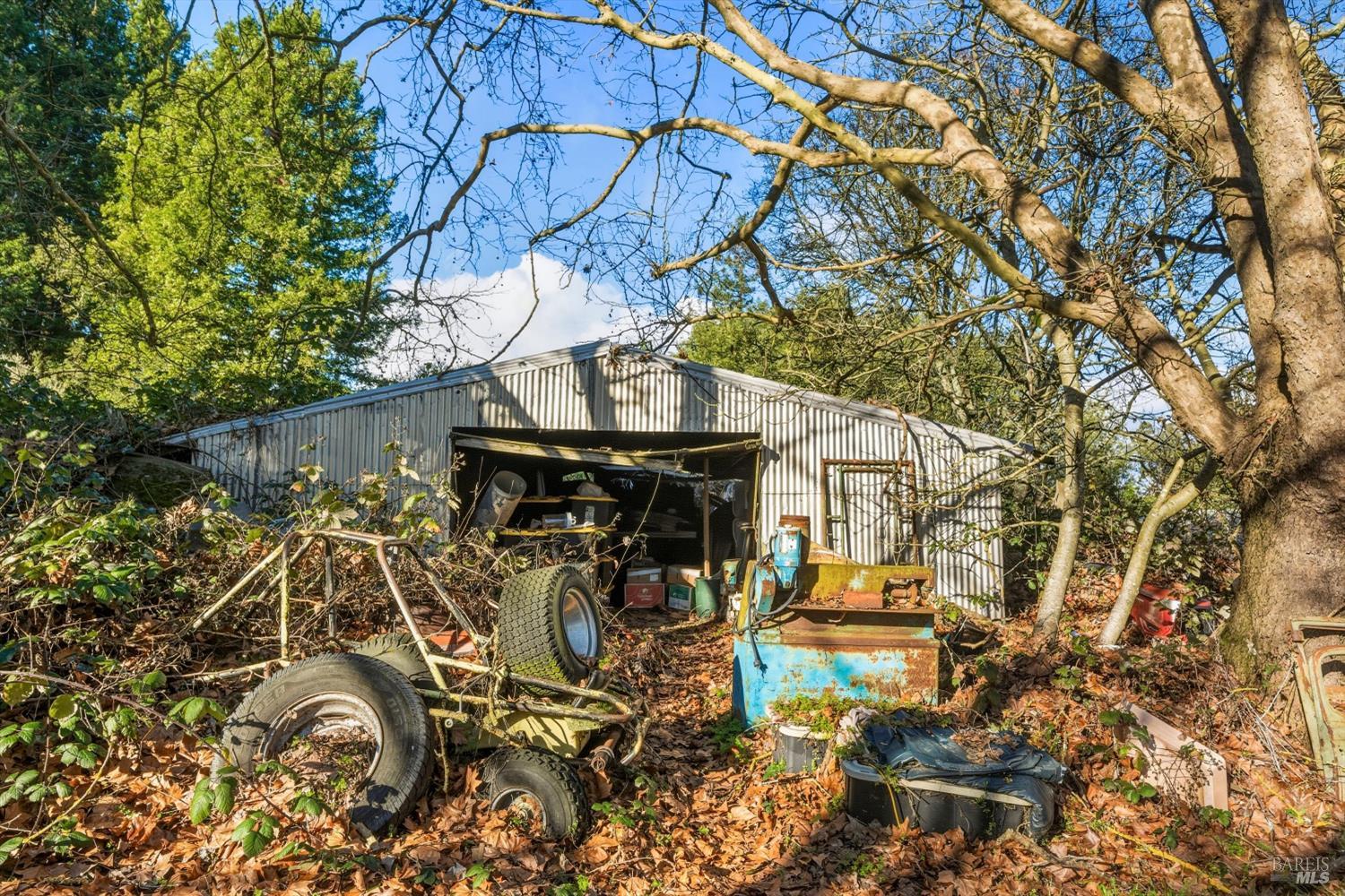 5070 Blank Road Sebastopol, CA 95472 - Photo 27 of 36 a view of a patio with table and chairs and potted plants