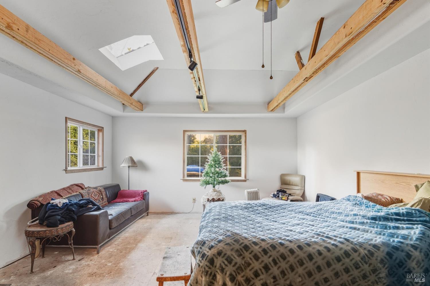 5070 Blank Road Sebastopol, CA 95472 - Photo 34 of 36 a bedroom with a bed and wooden floor