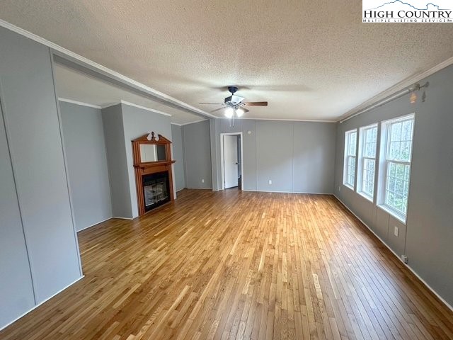 68 Rhoneys View Road Newland, NC 28657 - Photo 17 of 37 wooden floor in an empty room with a window