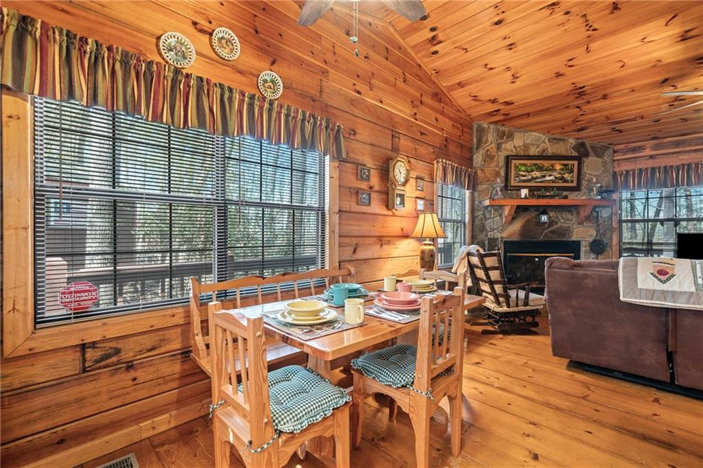 301 Laurel Creek Road Blue Ridge, GA 30513 - Photo 12 of 36 a view of a patio with a table and chairs