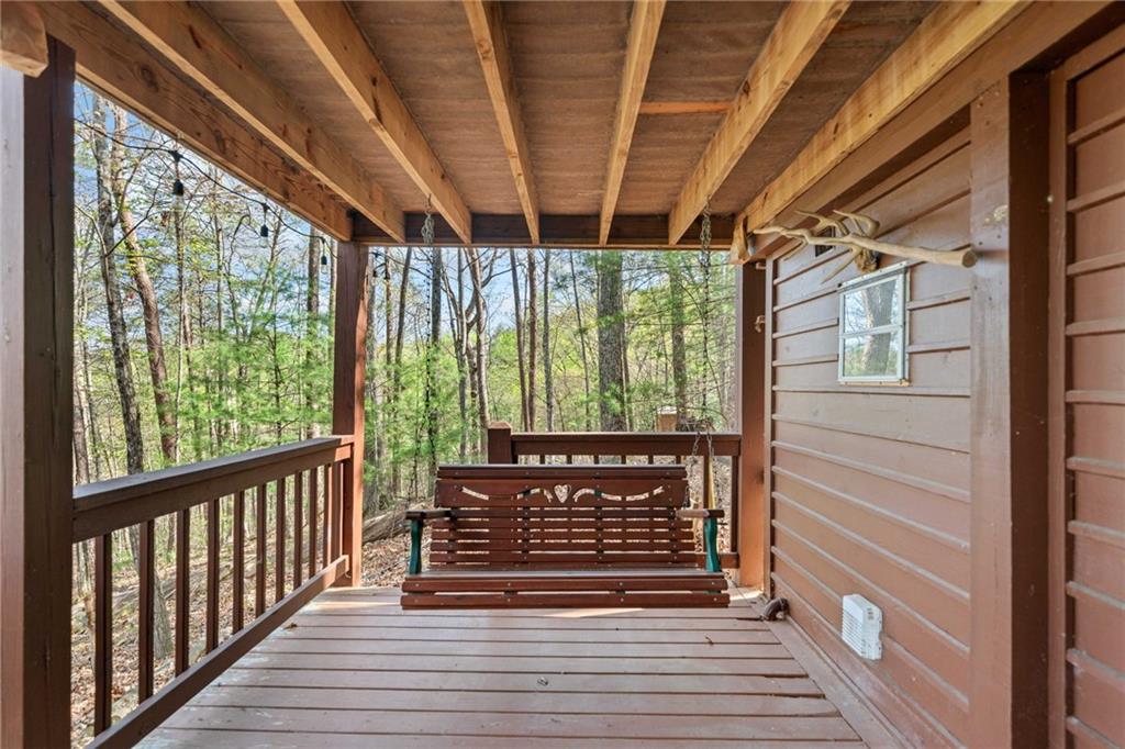 301 Laurel Creek Road Blue Ridge, GA 30513 - Photo 23 of 36 a view of a porch with wooden floor and outdoor space
