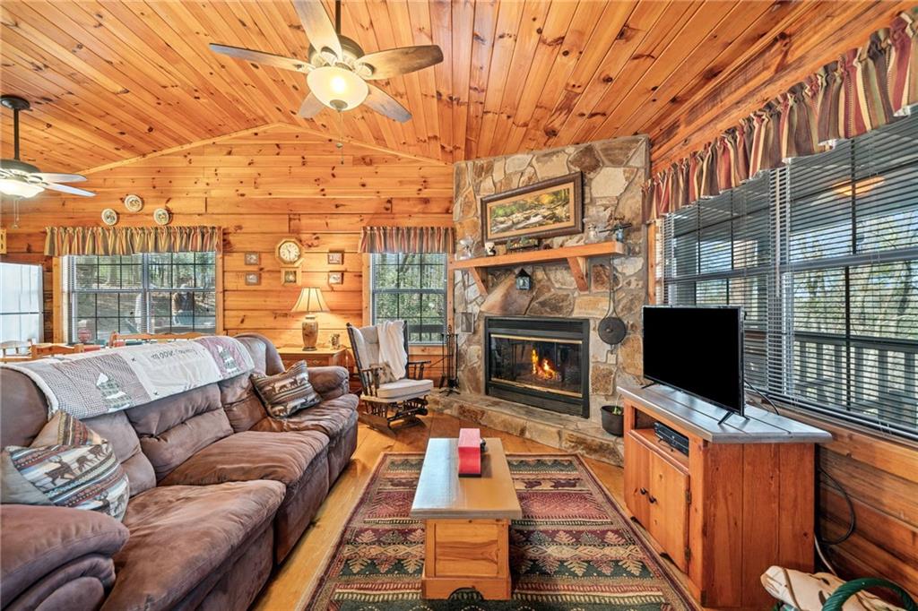 301 Laurel Creek Road Blue Ridge, GA 30513 - Photo 6 of 36 a outdoor space with patio the couches and a flat screen tv