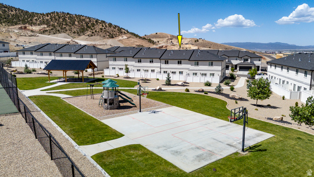 668 East Fiddlers Canyon Road, Unit 6 Cedar City, UT 84721 - Photo 35 of 36 Community park featuring a basketball court, playground, and shaded gazebo