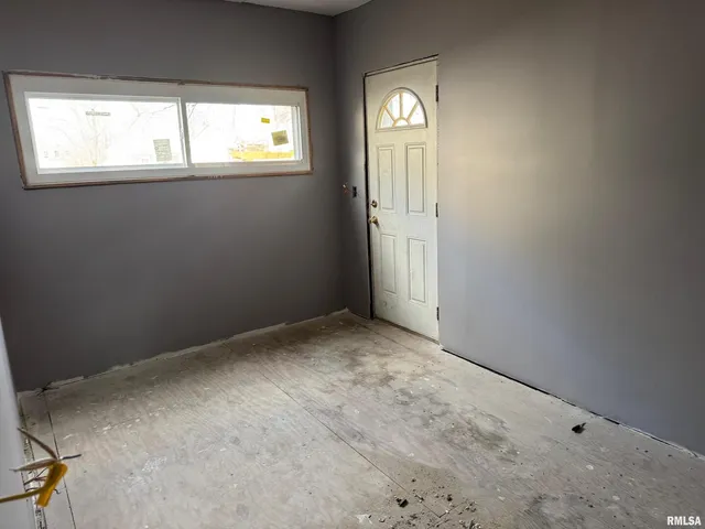 an empty room with windows