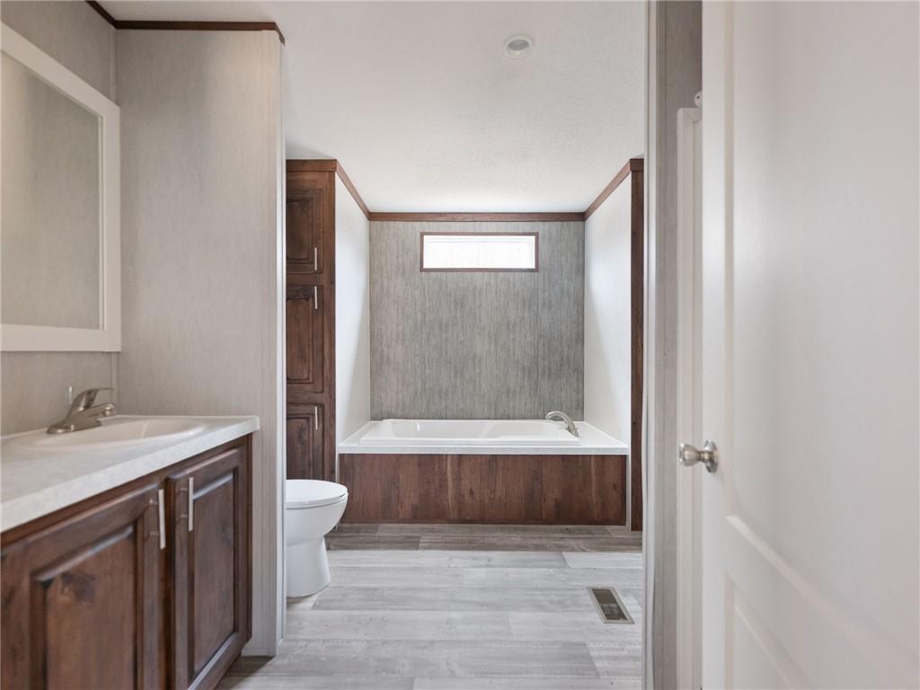 5224 Bogus Road Gainesville, GA 30506 - Photo 16 of 43 a bathroom with a sink a toilet and shower