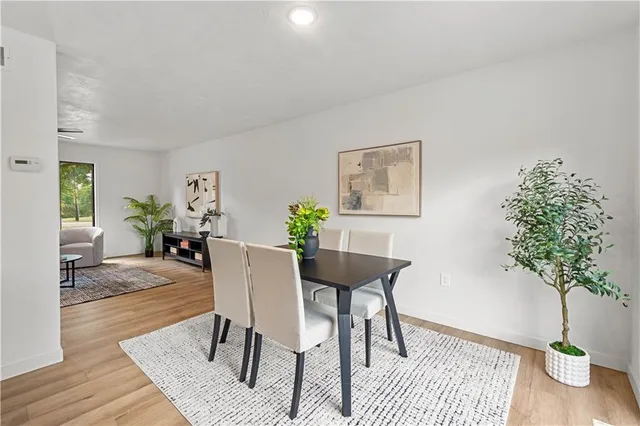 a kitchen with a sink stove top oven and refrigerator