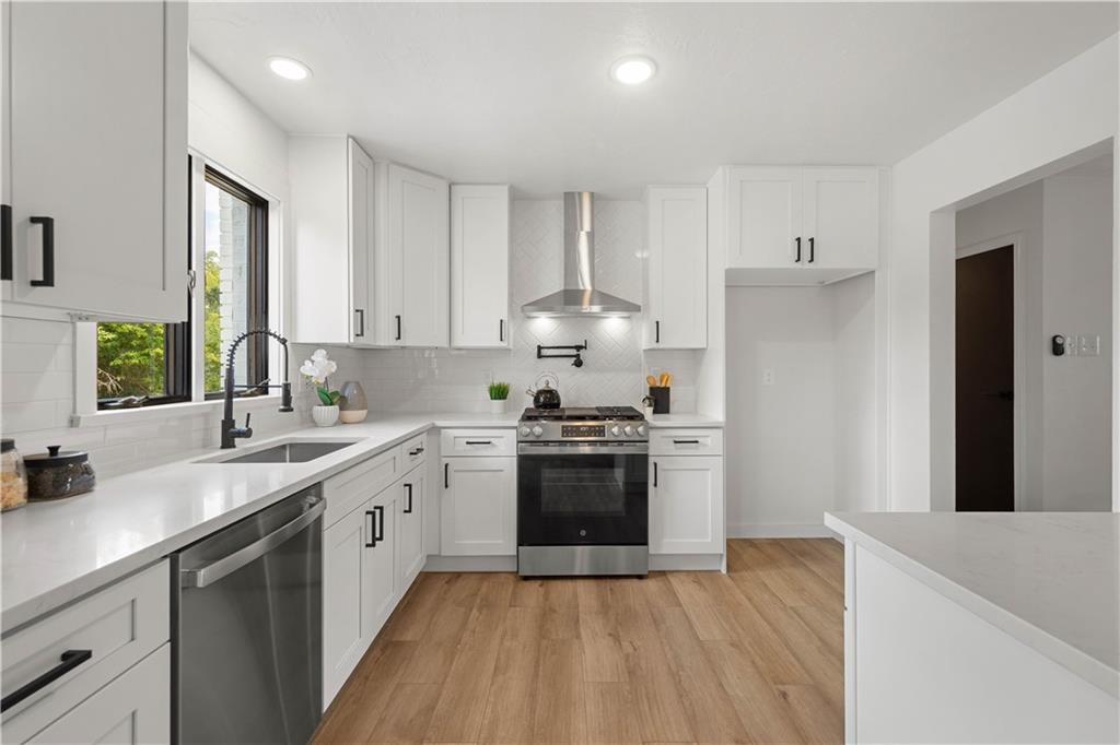 1546 West Ingomar Road Pittsburgh, PA 15237 - Photo 13 of 49 a kitchen with a sink stove top oven and refrigerator