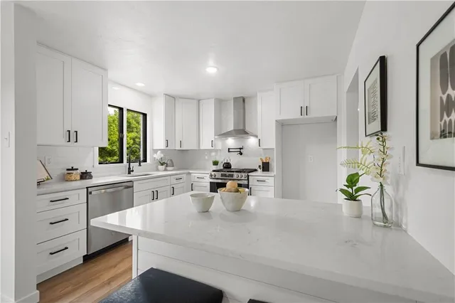 a view of kitchen with furniture and wooden floor