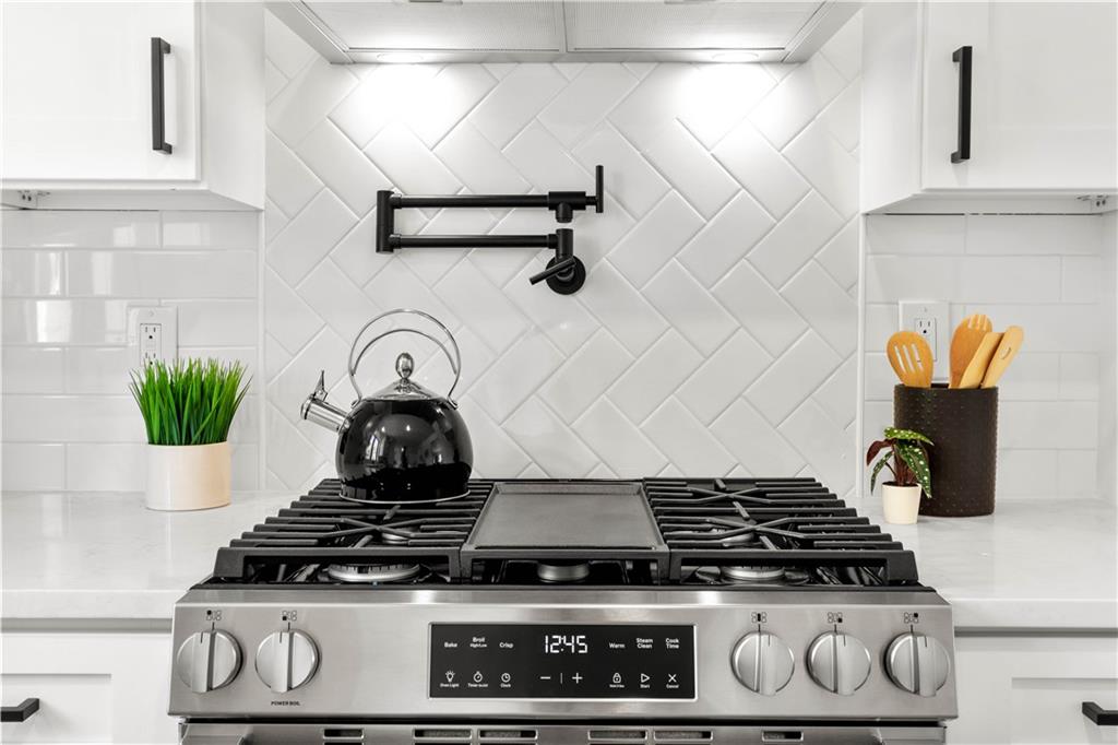 1546 West Ingomar Road Pittsburgh, PA 15237 - Photo 19 of 49 a stove top oven sitting inside of a kitchen