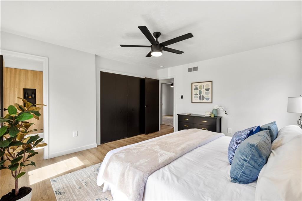 1546 West Ingomar Road Pittsburgh, PA 15237 - Photo 21 of 49 a bedroom with a large bed and a chandelier