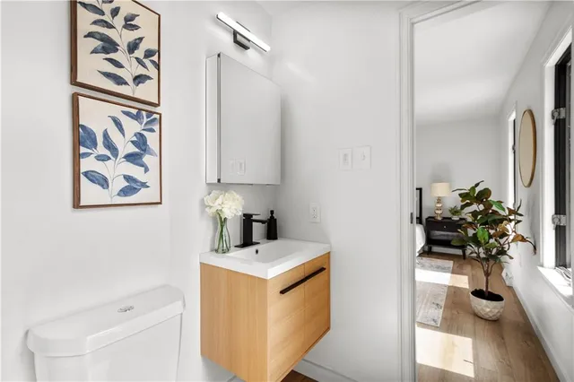 a view of an empty room with a ceiling fan