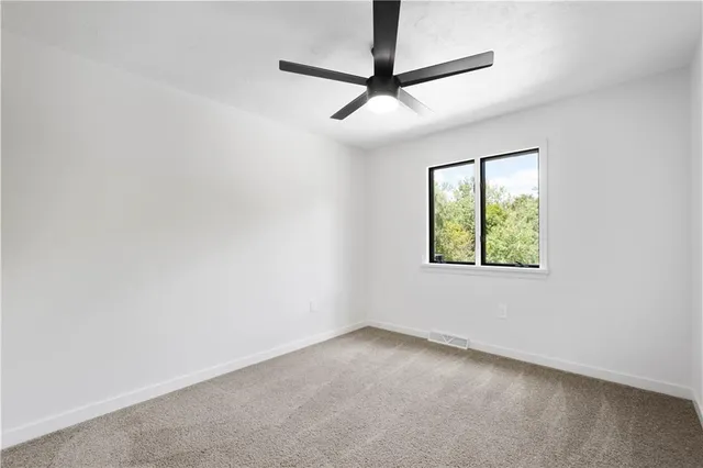 a bathroom with a double vanity sink toilet and a mirror