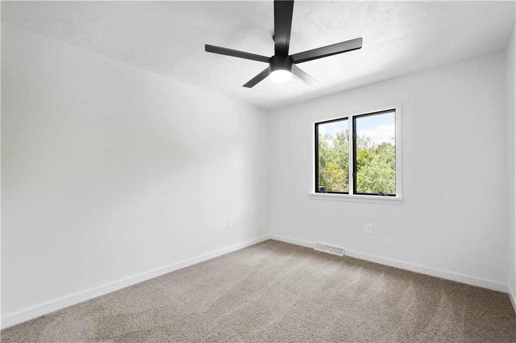 1546 West Ingomar Road Pittsburgh, PA 15237 - Photo 28 of 49 an empty room with windows and fan