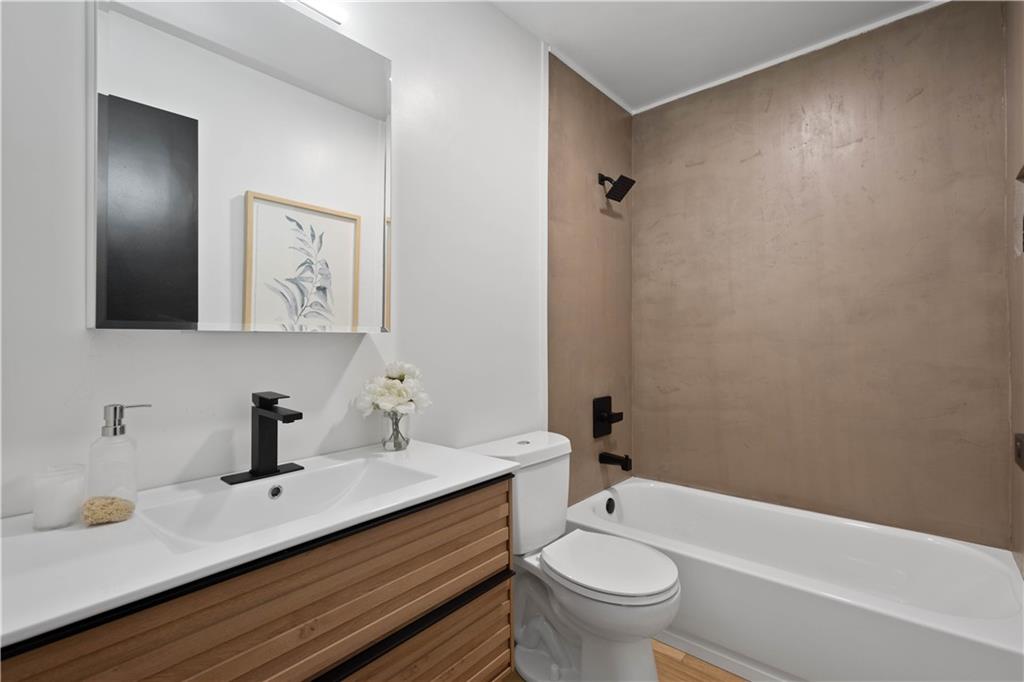 1546 West Ingomar Road Pittsburgh, PA 15237 - Photo 29 of 49 a bathroom with a double vanity sink toilet and a mirror