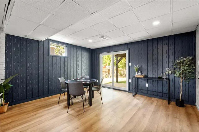 a view of a dining room with furniture and window
