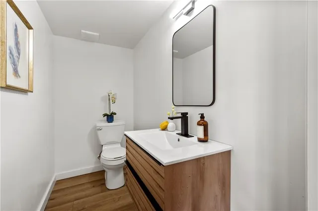 a balcony with furniture and a potted plant