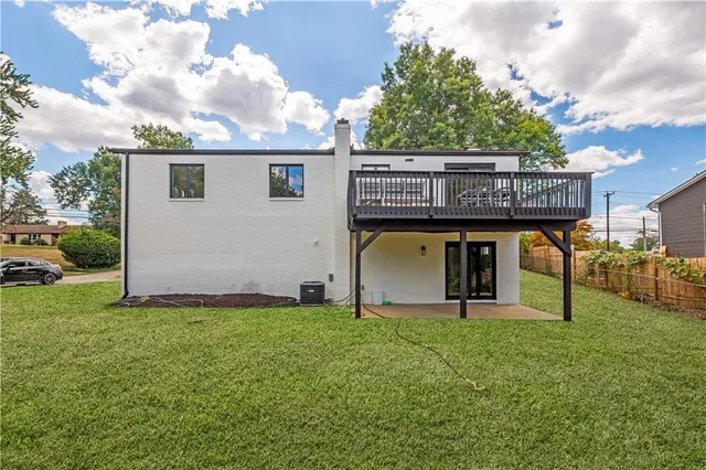 a aerial view of a house with a yard