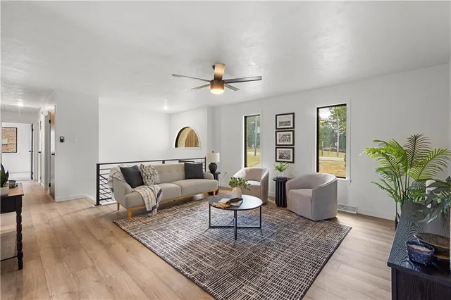 a living room with furniture and a rug