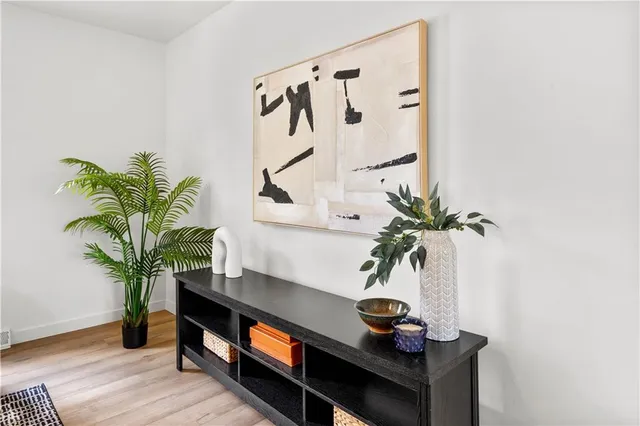 a view of a dining room with furniture window and wooden floor