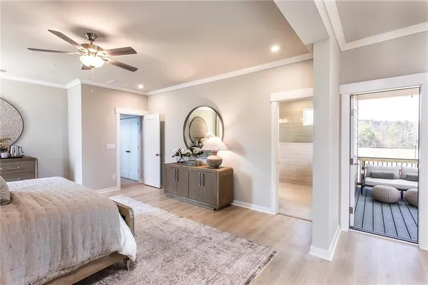a room with a sink and mirror with wooden floor