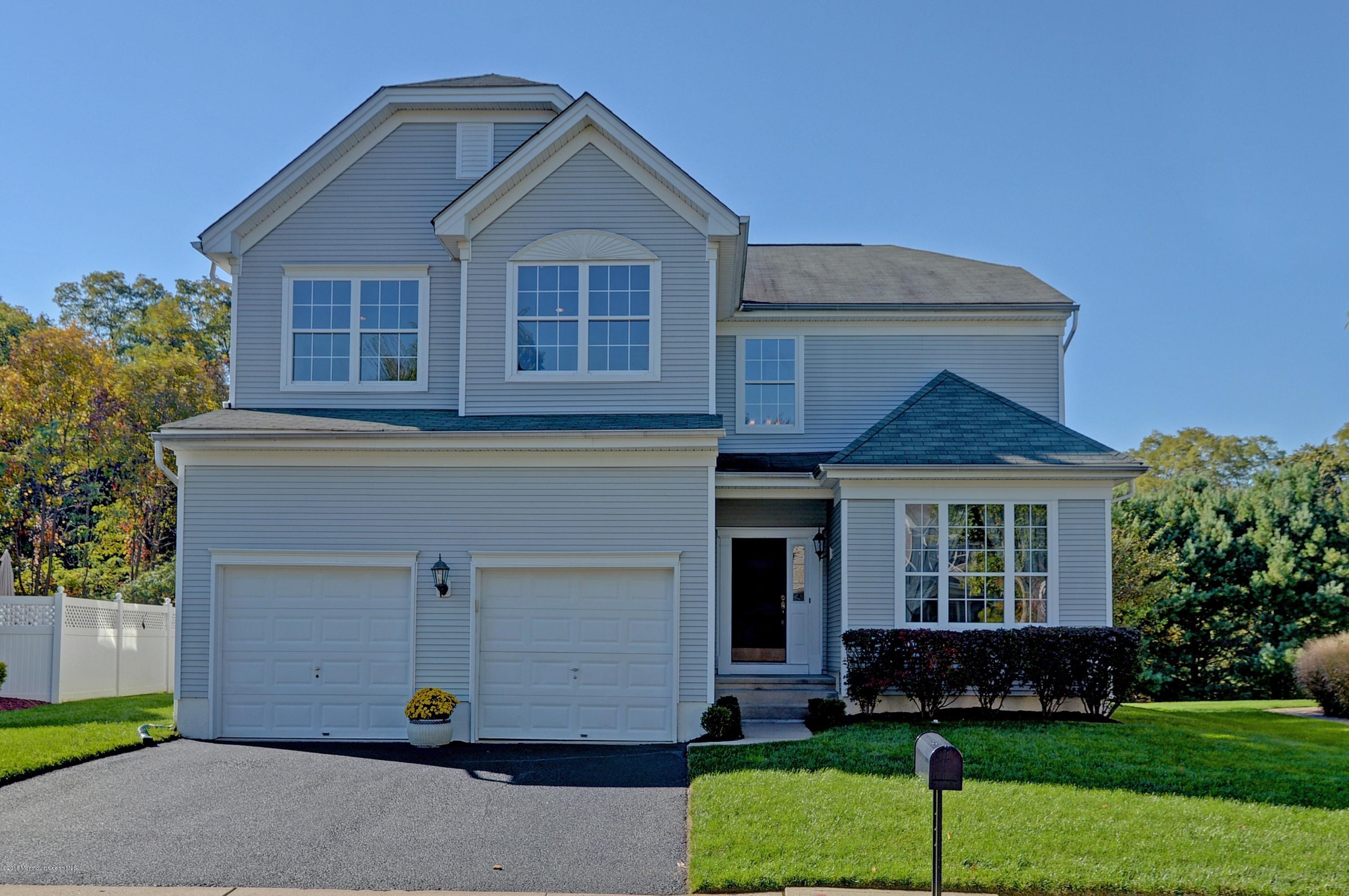 323 Wedgewood Road Morganville, NJ 07751 - Photo 1 of 27 a front view of a house with a yard