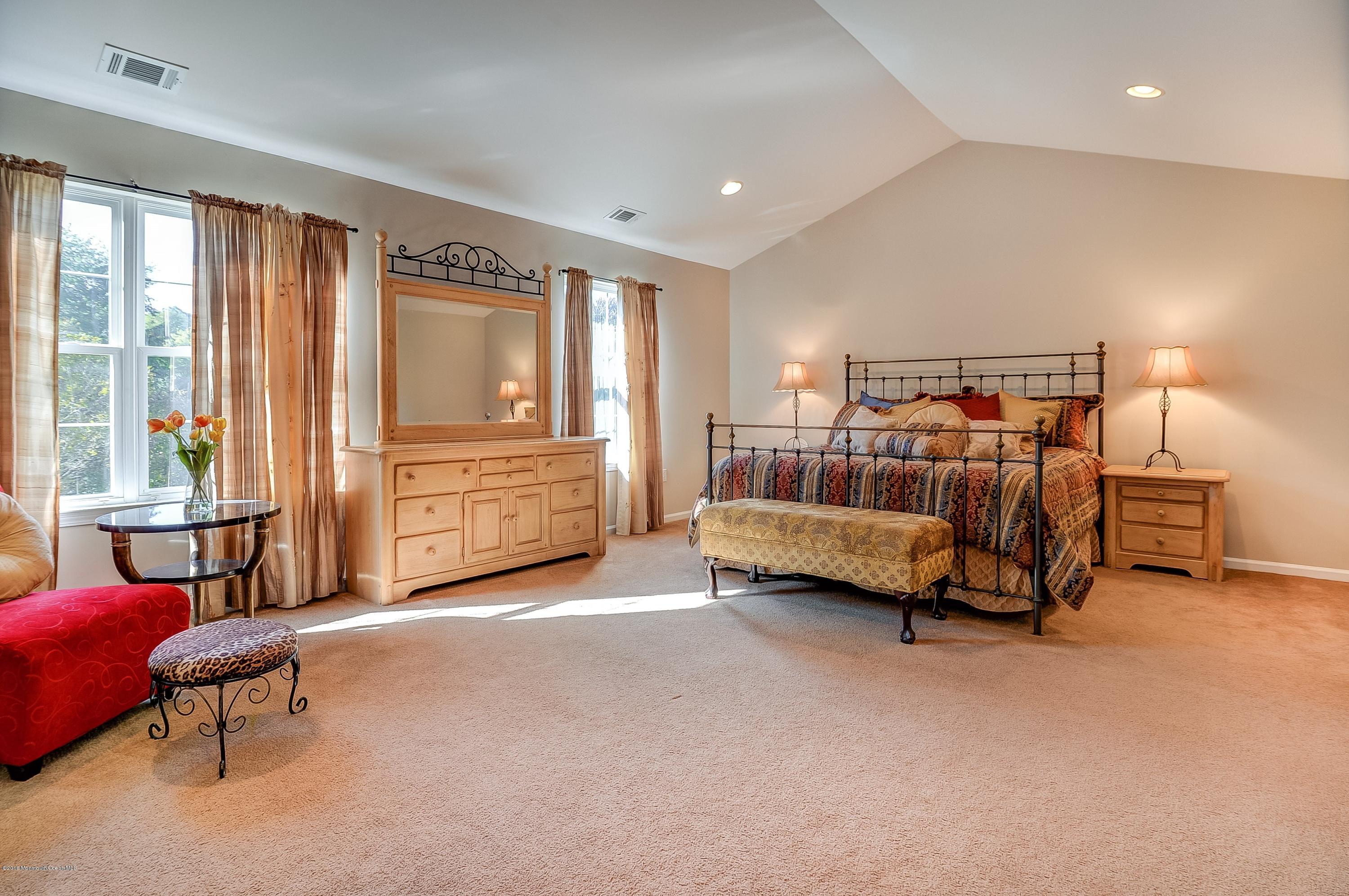 323 Wedgewood Road Morganville, NJ 07751 - Photo 16 of 27 a bedroom with furniture and a window