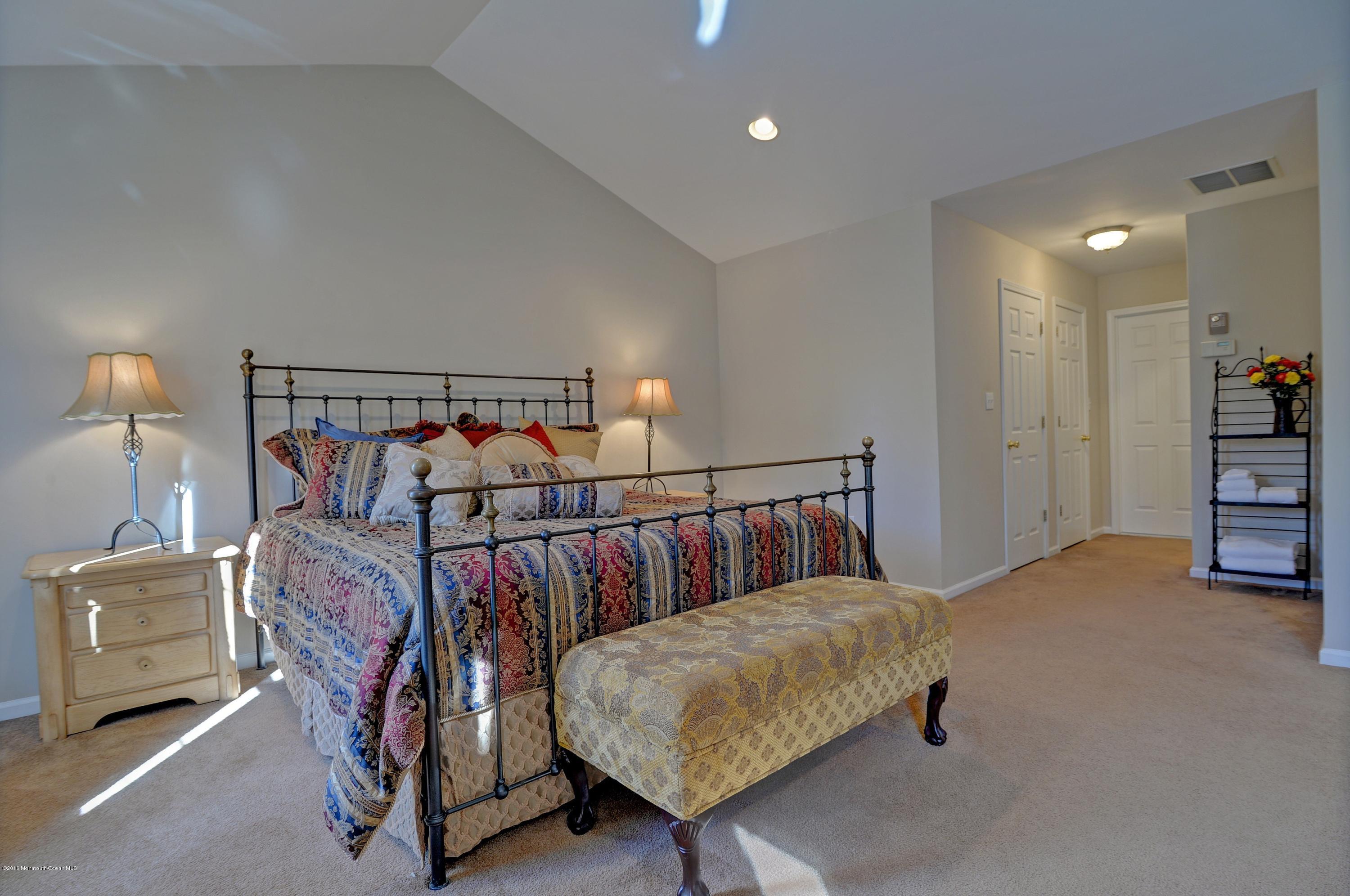 323 Wedgewood Road Morganville, NJ 07751 - Photo 17 of 27 a bedroom with furniture and a rug