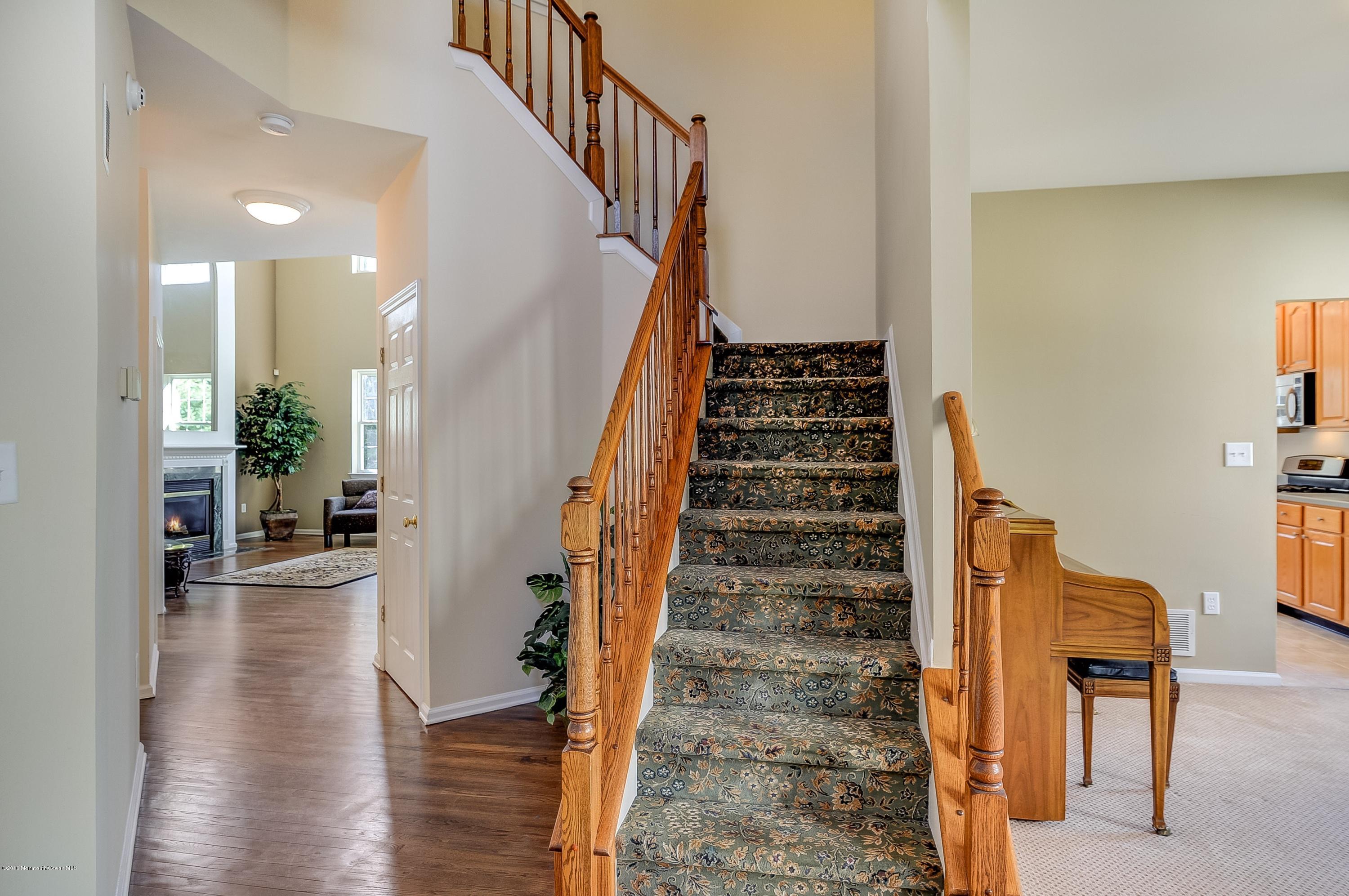 323 Wedgewood Road Morganville, NJ 07751 - Photo 2 of 27 a view of entryway and hall with wooden floor