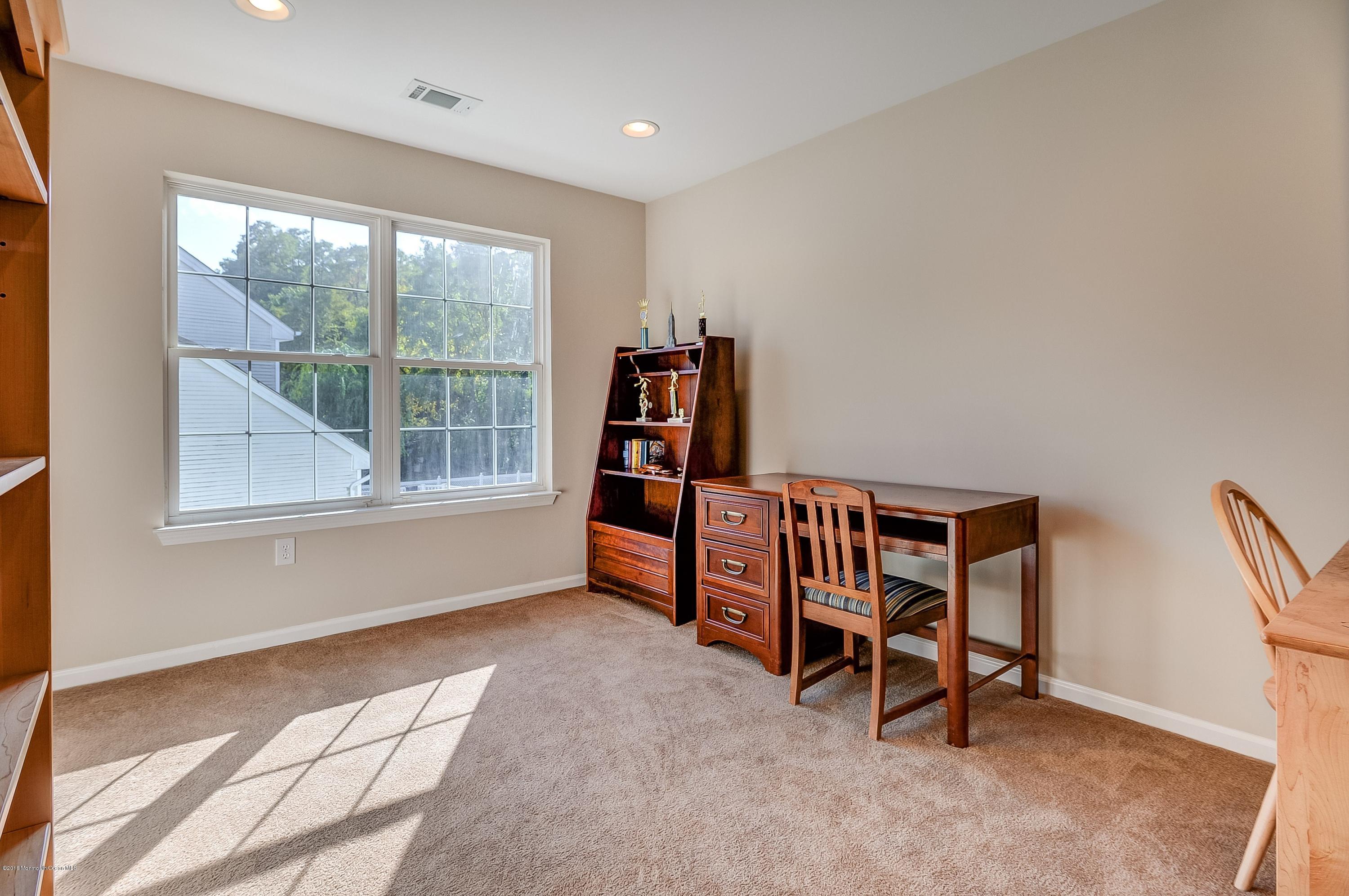 323 Wedgewood Road Morganville, NJ 07751 - Photo 22 of 27 a bedroom with furniture and a window