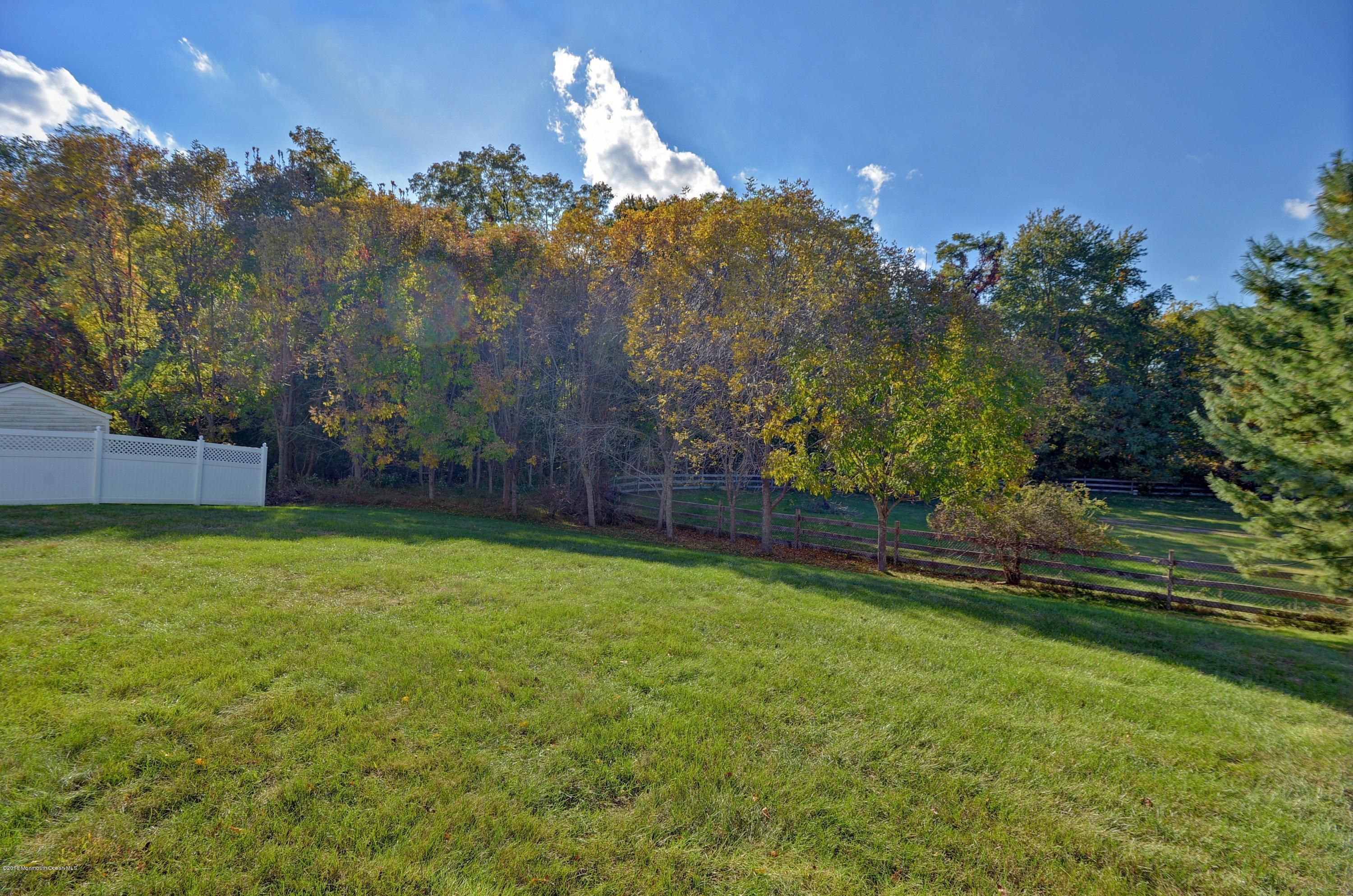 323 Wedgewood Road Morganville, NJ 07751 - Photo 26 of 27 a view of an outdoor space and a yard