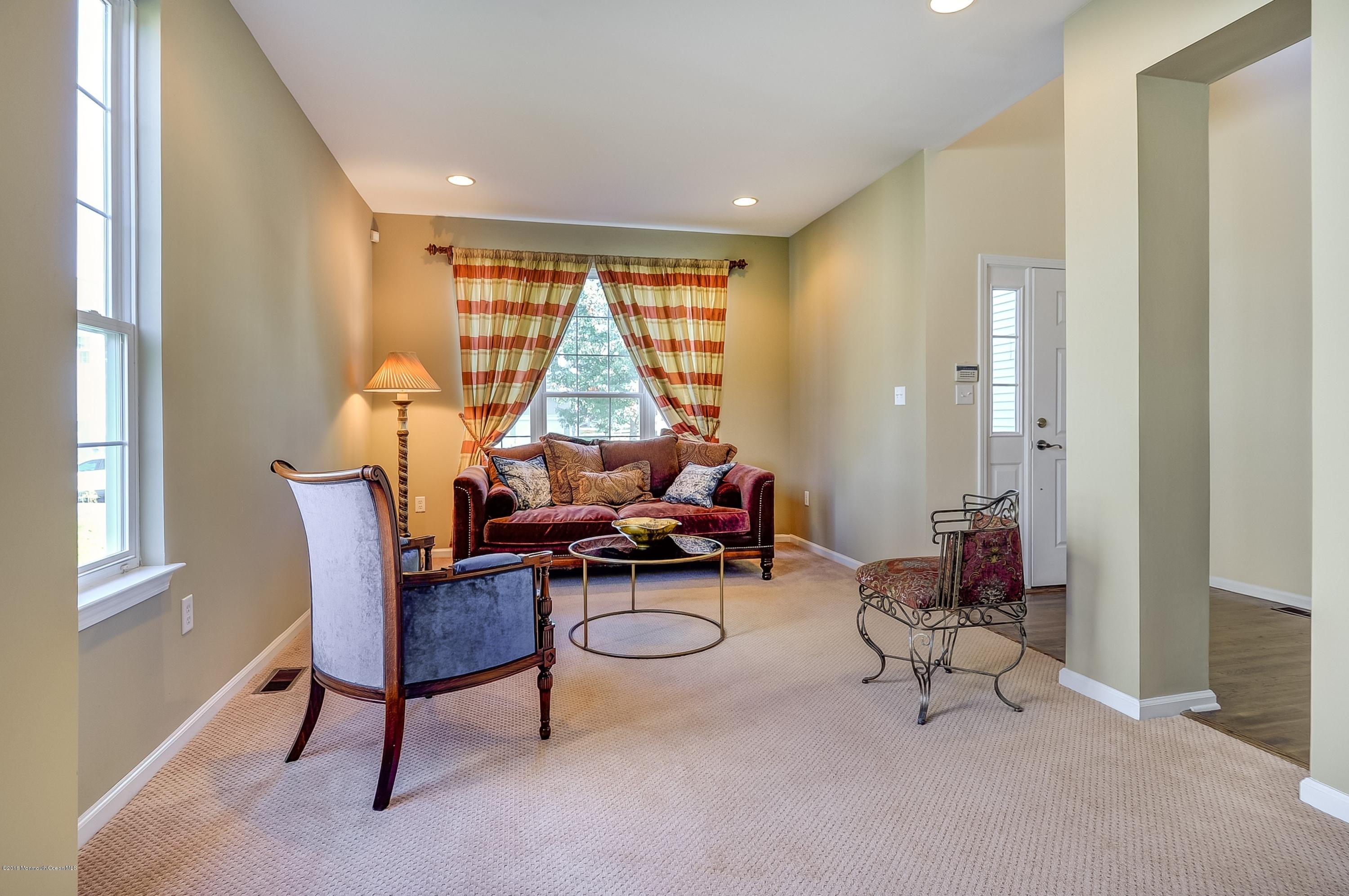 323 Wedgewood Road Morganville, NJ 07751 - Photo 3 of 27 a living room with furniture and a window