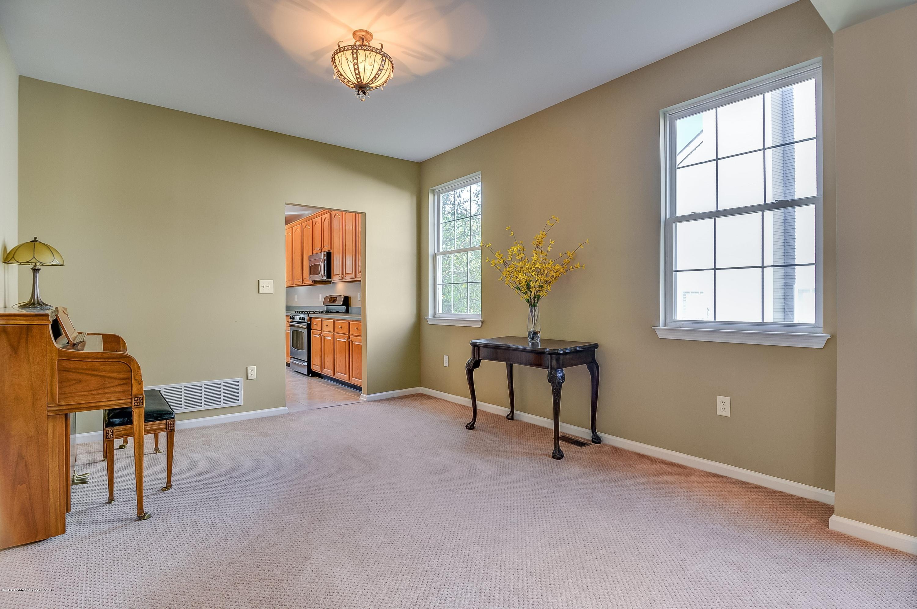 323 Wedgewood Road Morganville, NJ 07751 - Photo 5 of 27 a view of a workspace with furniture and a window