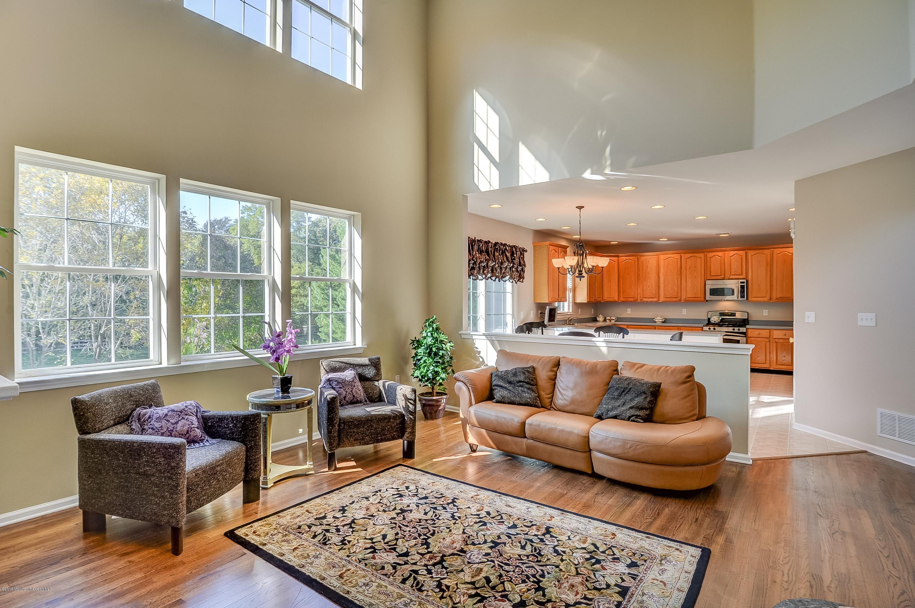 323 Wedgewood Road Morganville, NJ 07751 - Photo 8 of 27 a living room with furniture and a rug