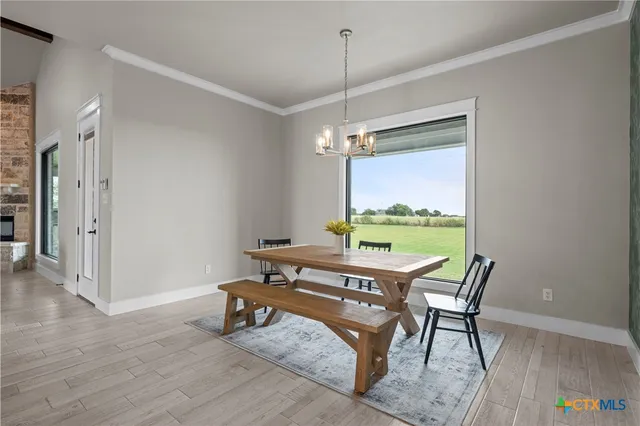 a view of a room with furniture window and wooden floor