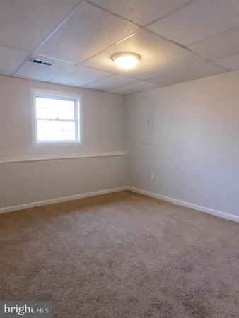 an empty room with a empty space and a window