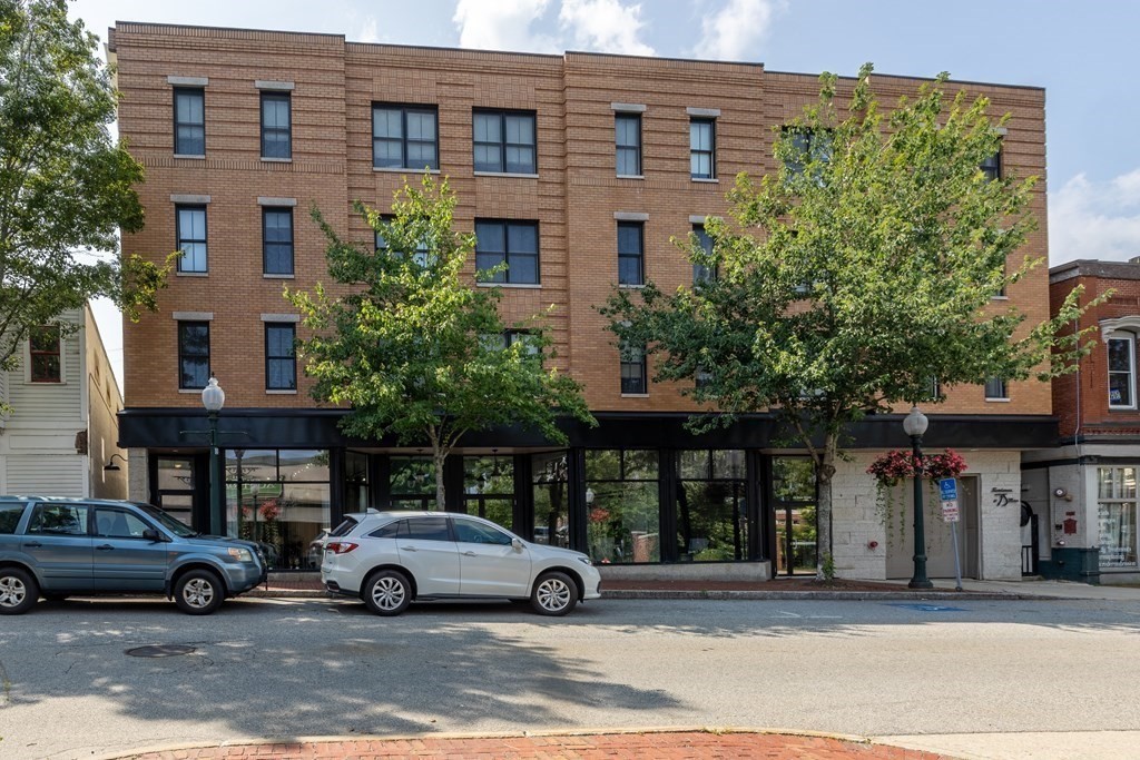 75 Main Street, Unit 102 Amesbury, MA 01913 - Photo 25 of 28 a view of a car parked in front of a building