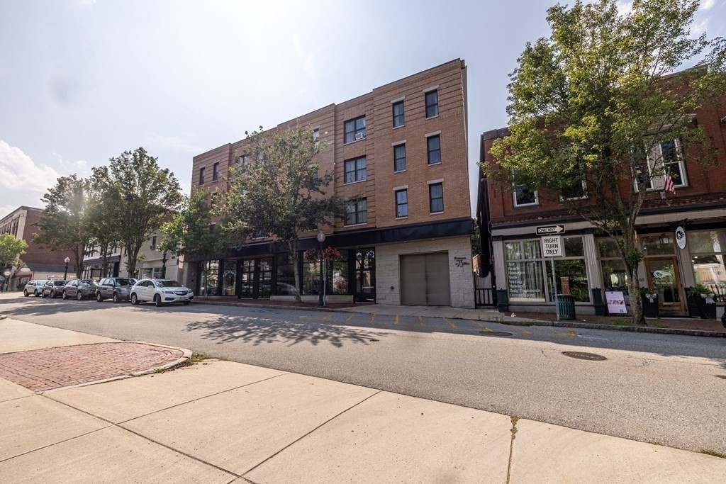 75 Main Street, Unit 102 Amesbury, MA 01913 - Photo 26 of 28 a front view of a building with street view