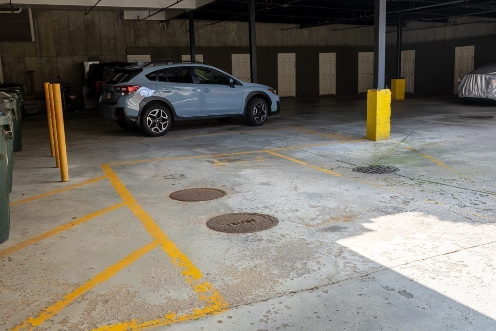 75 Main Street, Unit 102 Amesbury, MA 01913 - Photo 27 of 28 a view of a car parked in the parking space