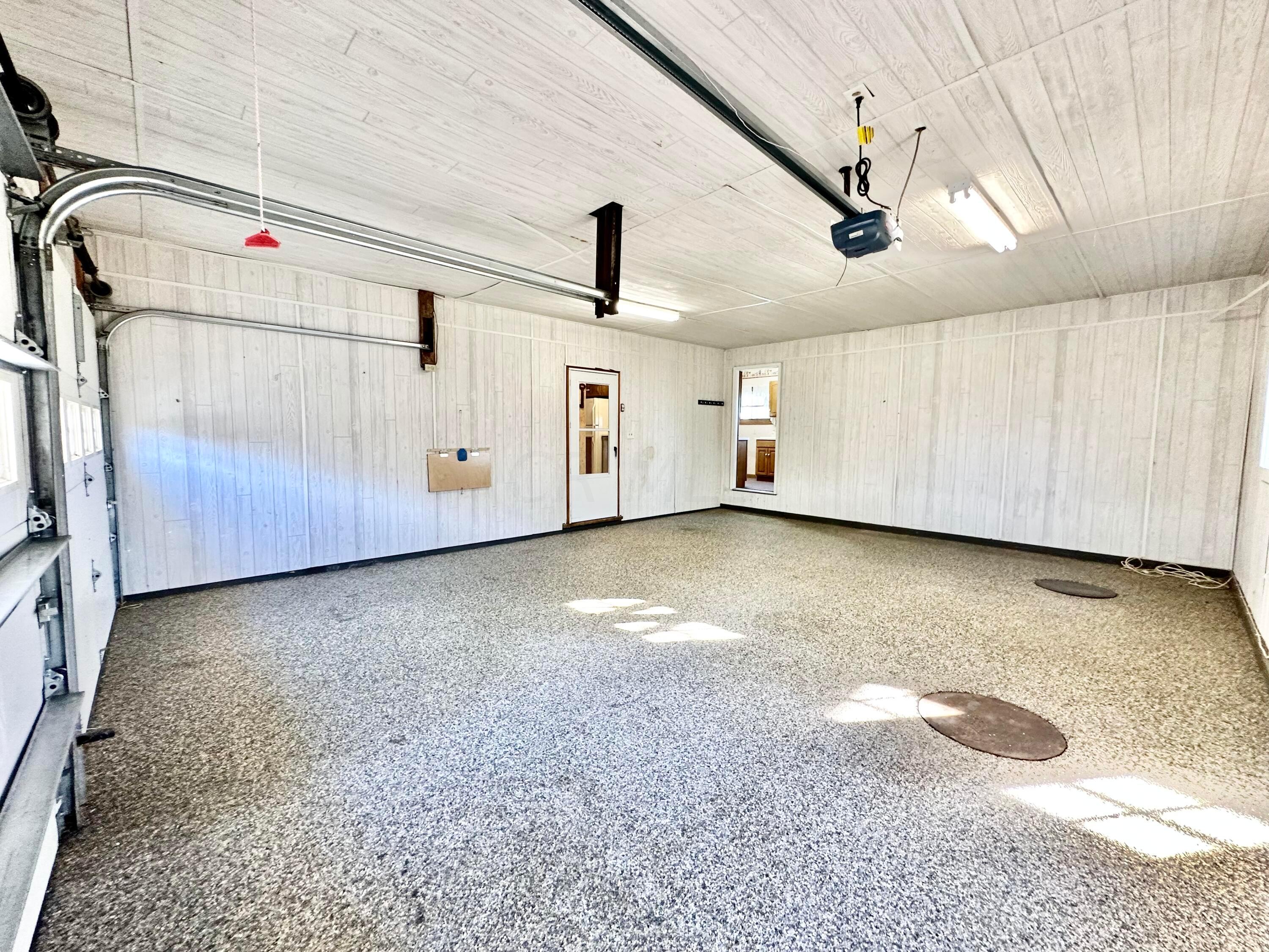 6189 Giehl Road Delaware, OH 43015 - Photo 45 of 70 Attached 2 car garage w/entry to basement stair landing and main level laundry/utility.