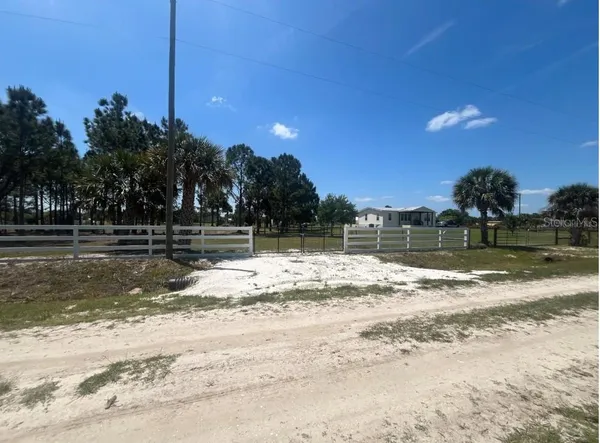 a view of a yard with swimming pool