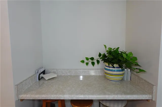a view of a livingroom with furniture window and wooden floor