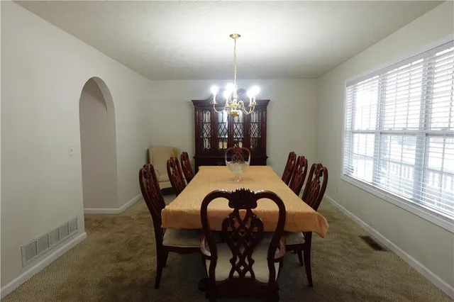 a view of a kitchen from the hallway