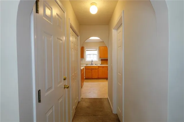 a kitchen with a sink and cabinets