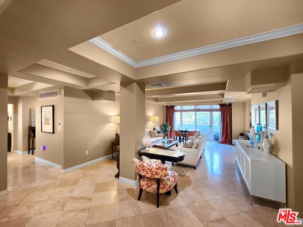 a living room with furniture and white walls