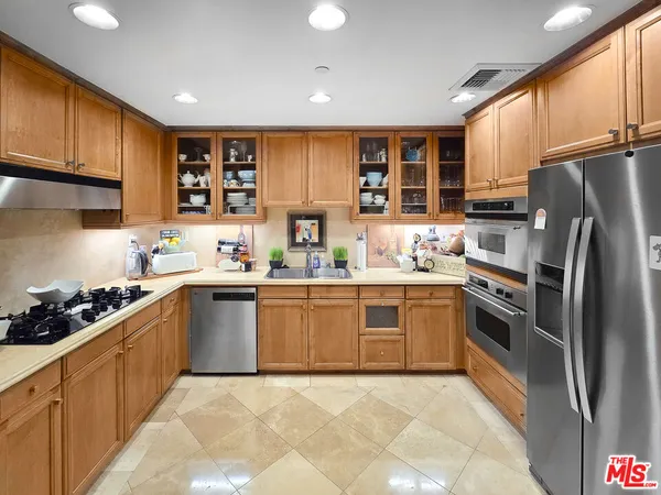 a kitchen with a sink stove and refrigerator