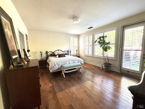 a bedroom with furniture and a window