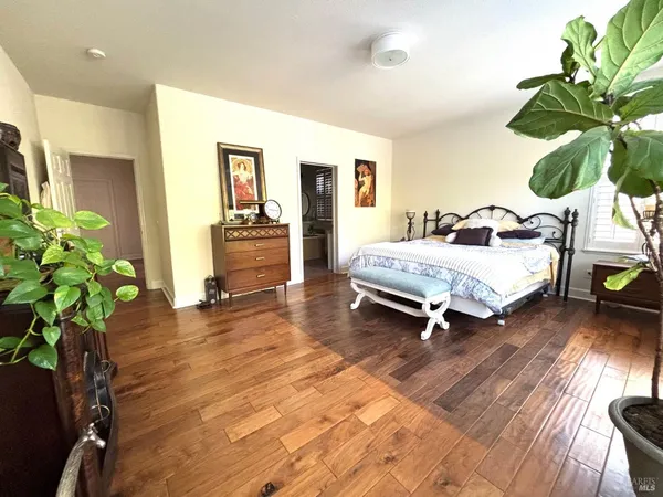 a bedroom with a bed and a couch