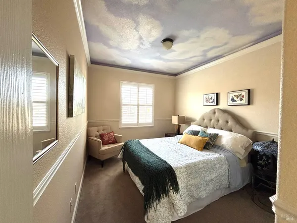 a bedroom with a bed and a couch